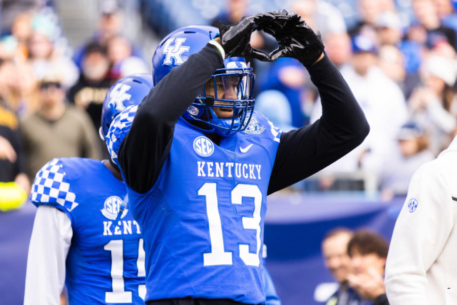Kentucky Wildcats wide receiver Jordan Anthony (13) makes a heart at UK fans before the Kentucky vs. Iowa Music City Bowl football game on Saturday, Dec. 31, 2022, at Nissan Stadium in Nashville, Tennessee. UK lost 21-0. Photo by Isabel McSwain | Staff