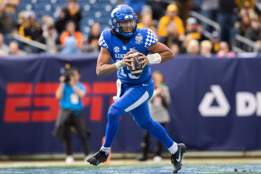 Kentucky Wildcats quarterback Destin Wade (15) runs the ball during the Kentucky vs. Iowa Music City Bowl football game on Saturday, Dec. 31, 2022, at Nissan Stadium in Nashville, Tennessee. UK lost 21-0. Photo by Isabel McSwain | Staff