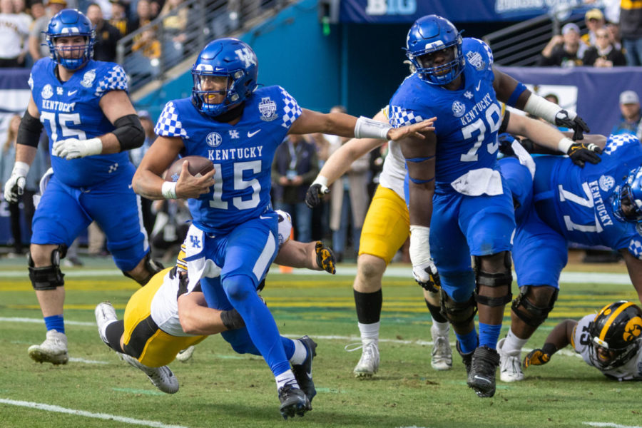 Kentucky Wildcats quarterback Destin Wade (15) runs the ball during the Kentucky vs. Iowa Music City Bowl football game on Saturday, Dec. 31, 2022, at Nissan Stadium in Nashville, Tennessee. UK lost 21-0. Photo by Travis Fannon | Staff