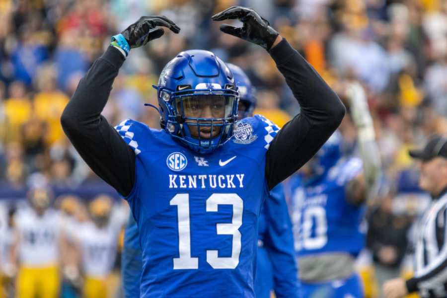 Kentucky Wildcats linebacker J.J. Weaver (13) hypes up the crowd during the Kentucky vs. Iowa Music City Bowl football game on Saturday, Dec. 31, 2022, at Nissan Stadium  in Nashville, Tennessee. UK lost 21-0. Photo by Travis Fannon | Staff