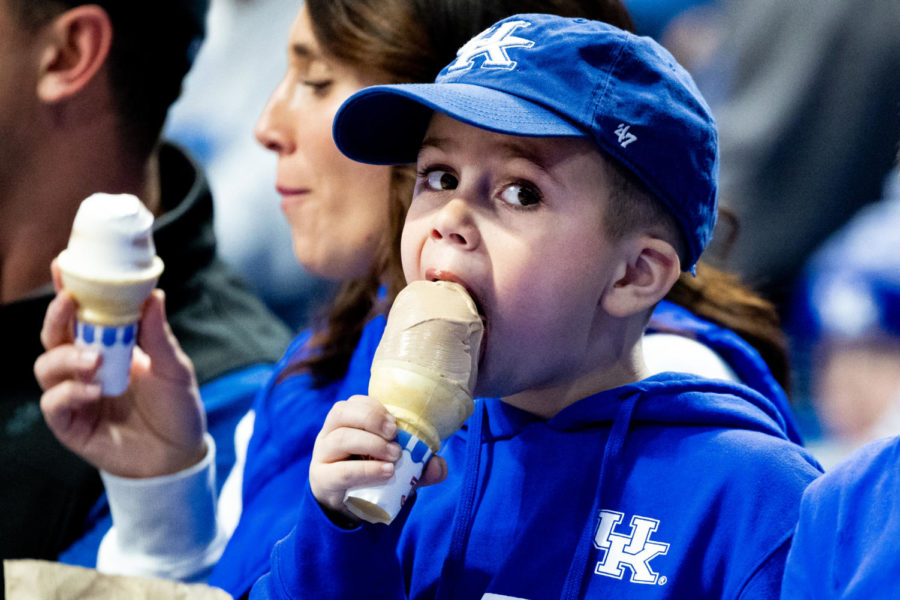 A young Kentucky fan eats ice cream during the No. 19 Kentucky vs. Florida A&amp;M mens basketball game on Wednesday, Dec. 21, 2022, at Rupp Arena in Lexington, Kentucky. UK won 88-68. Photo by Jack Weaver | Staff