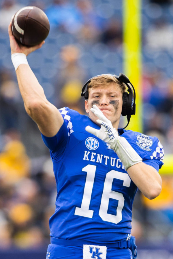Kentucky Wildcats quarterback Deuce Hogan (16) warms up by throwing the ball during the Kentucky vs. Iowa Music City Bowl football game on Saturday, Dec. 31, 2022, at Nissan Stadium in Nashville, Tennessee. UK lost 21-0. Photo by Isabel McSwain | Staff