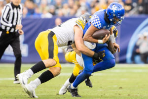 Kentucky Wildcats quarterback Destin Wade (15) is tackled during the Kentucky vs. Iowa Music City Bowl football game on Saturday, Dec. 31, 2022, at Nissan Stadium in Nashville, Tennessee. UK lost 21-0. Photo by Isabel McSwain | Staff