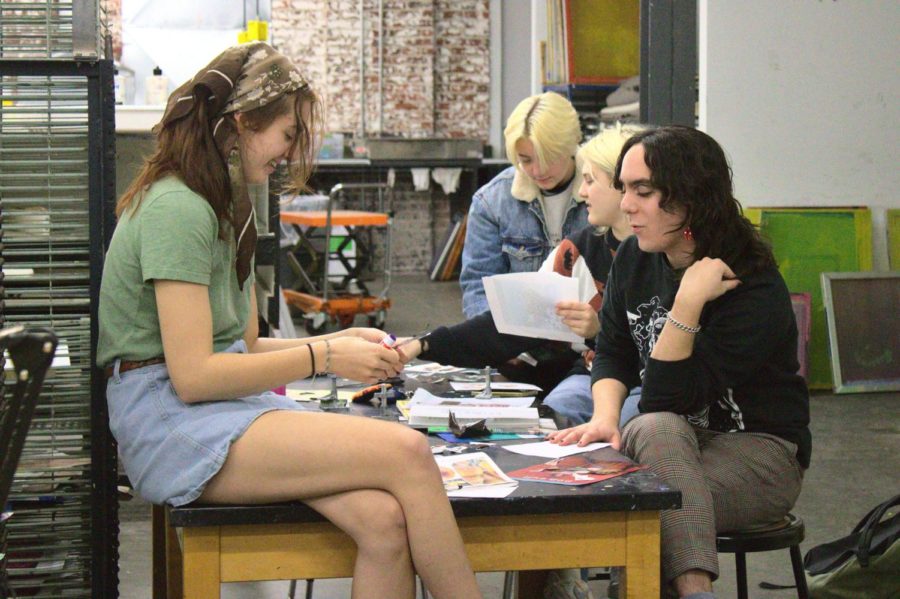 Seniors Abby Haley and Quinn Troia converse during the Zine Club meeting on Friday, Nov. 18, 2022, at the Art & Visual Studies Building in Lexington, Kentucky. Photo by Brady Saylor | Staff