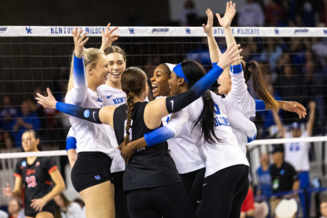 Kentucky players celebrate during the No. 3 Kentucky vs. WKU volleyball match in the second round of the NCAA Tournament on Friday, Dec. 2, 2022, at Memorial Coliseum in Lexington, Kentucky. UK won 3-0. Photo by Isabel McSwain | Staff