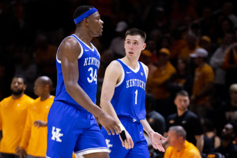 Kentucky Wildcats guard CJ Fredrick (1) talks to forward Oscar Tshiebwe (34) during the Kentucky vs. No. 5 Tennessee mens basketball game on Saturday, Jan. 14, 2023, at Thompson-Boling Arena in Knoxville, Tennessee. Kentucky won 63-56. Photo by Jack Weaver | Staff