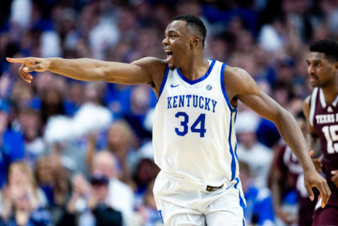 Kentucky Wildcats forward Oscar Tshiebwe (34) celebrates between plays during the Kentucky vs. Texas A&M men's basketball game on Saturday, Jan. 21, 2023, at Rupp Arena in Lexington, Kentucky. Kentucky won 76-67. Photo by Jack Weaver | Staff