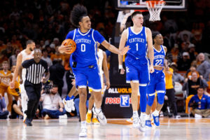 Kentucky Wildcats forward Jacob Toppin (0) and guard CJ Fredrick (1) celebrate at the end of the Kentucky vs. No. 5 Tennessee mens basketball game on Saturday, Jan. 14, 2023, at Thompson-Boling Arena in Knoxville, Tennessee. Kentucky won 63-56. Photo by Jack Weaver | Staff