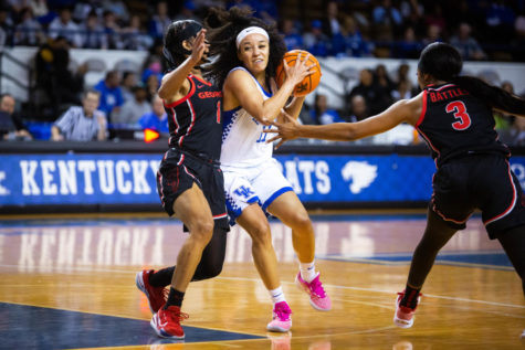 Kentucky Wildcats guard Jada Walker (11) collides with a defender during the Kentucky vs. Georgia womens basketball game on Thursday, Feb. 16, 2023, at Memorial Coliseum in Lexington, Kentucky. UK lost 50-40. Photo by Samuel Colmar | Staff
