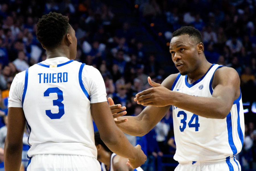 Kentucky Wildcats guard Adou Thiero (3) and forward Oscar Tshiebwe (34) talk during a timeout during the Kentucky vs. No. 10 Tennessee mens basketball game on Saturday, Feb. 18, 2023, at Rupp Arena in Lexington, Kentucky. Kentucky won 66-54. Photo by Brady Saylor | Staff