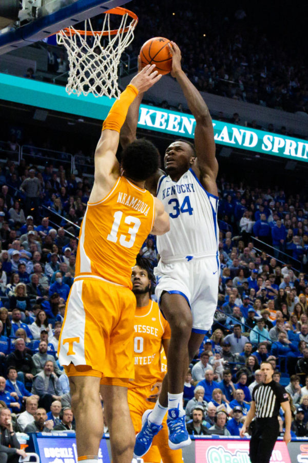 Kentucky Wildcats forward Oscar Tshiebwe (34) dunks the ball during the Kentucky vs. No. 10 Tennessee mens basketball game on Saturday, Feb. 18, 2023, at Rupp Arena in Lexington, Kentucky. Kentucky won 66-54. Photo by Brady Saylor | Staff