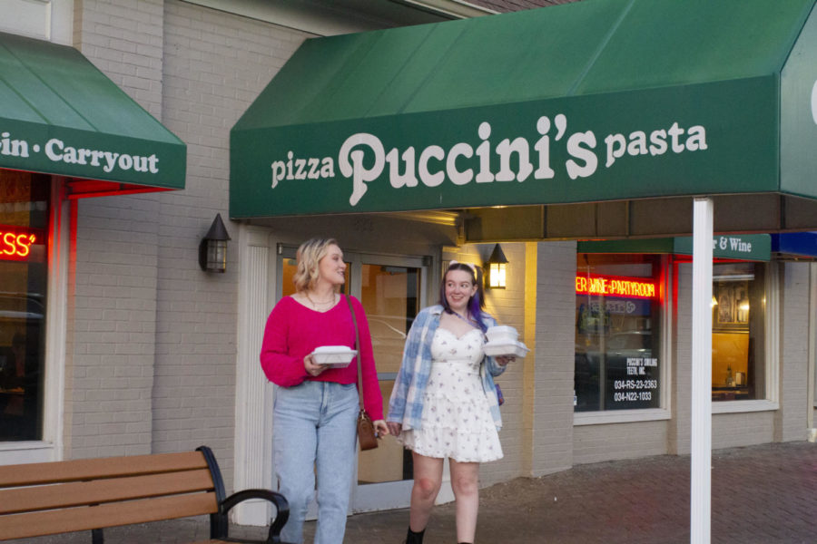 Ansley Colvin, left, and Brigid Whipp leave Puccini’s Pizza Pasta after their blind date on Sunday, Feb. 12, 2023, in Lexington, Kentucky. Photo by Maria Rauh | Staff
