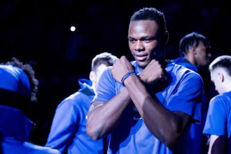 Kentucky Wildcats forward Oscar Tshiebwe (34) gestures at guard Kareem Watkins (25) during introductions before the Kentucky vs. Auburn mens basketball game on Saturday, Feb. 25, 2023, at Rupp Arena in Lexington, Kentucky. Kentucky won 86-54. Photo by Jack Weaver | Staff