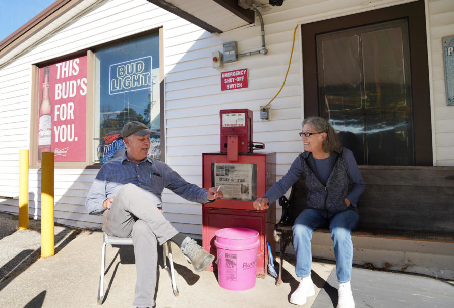 Owners Dan Midkiff and Katie Clark bump cigarettes outside Bald Knob Little Market, what they call their  “second home,” in Frankfort, Kentucky on Wednesday, Oct. 5, 2022. Photo by Bryce Towle.