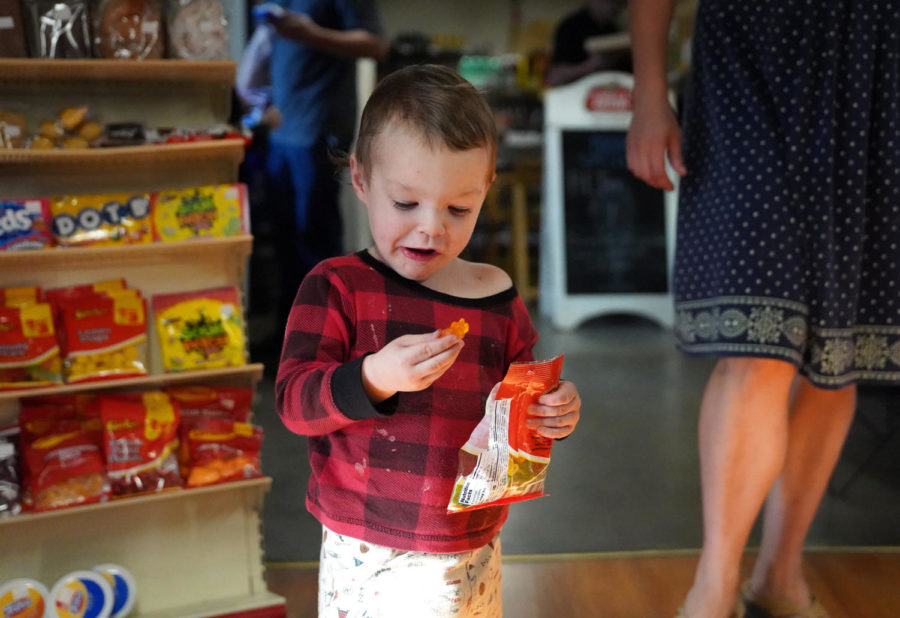 Micheal Joel Fleeman munches on gummy bears at Bald Knob Little Market, in Frankfort, Kentucky on Wednesday, Oct. 5, 2022. Photo by Bryce Towle.