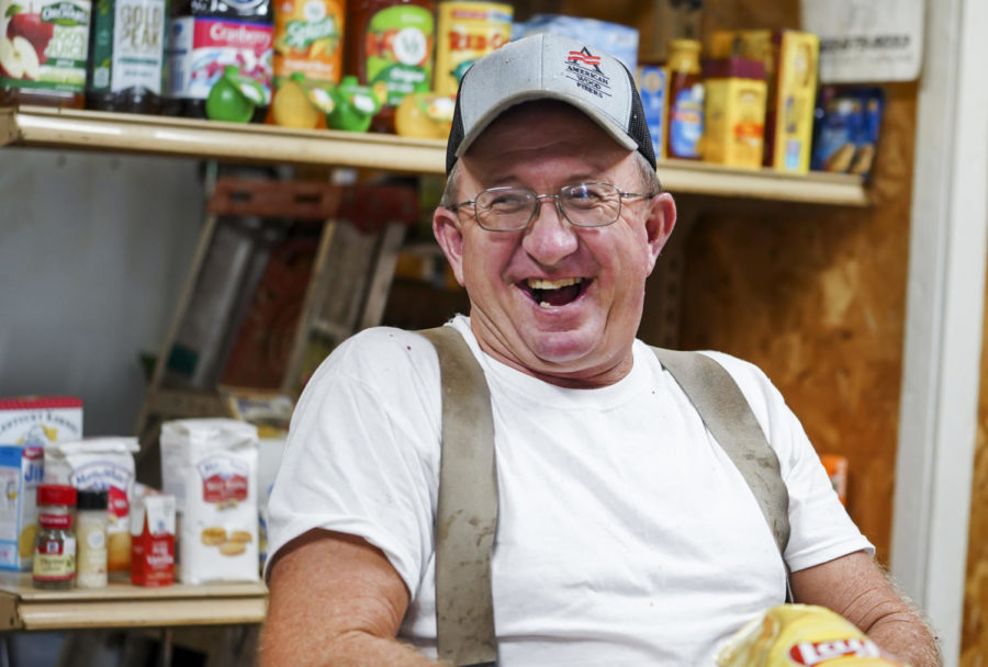 Mr.Slatterly laughs at jokes surrounded by local Bald Knob Little Market patrons, in Frankfort, Kentucky on Thursday, Oct. 6, 2022. Photo by Bryce Towle.