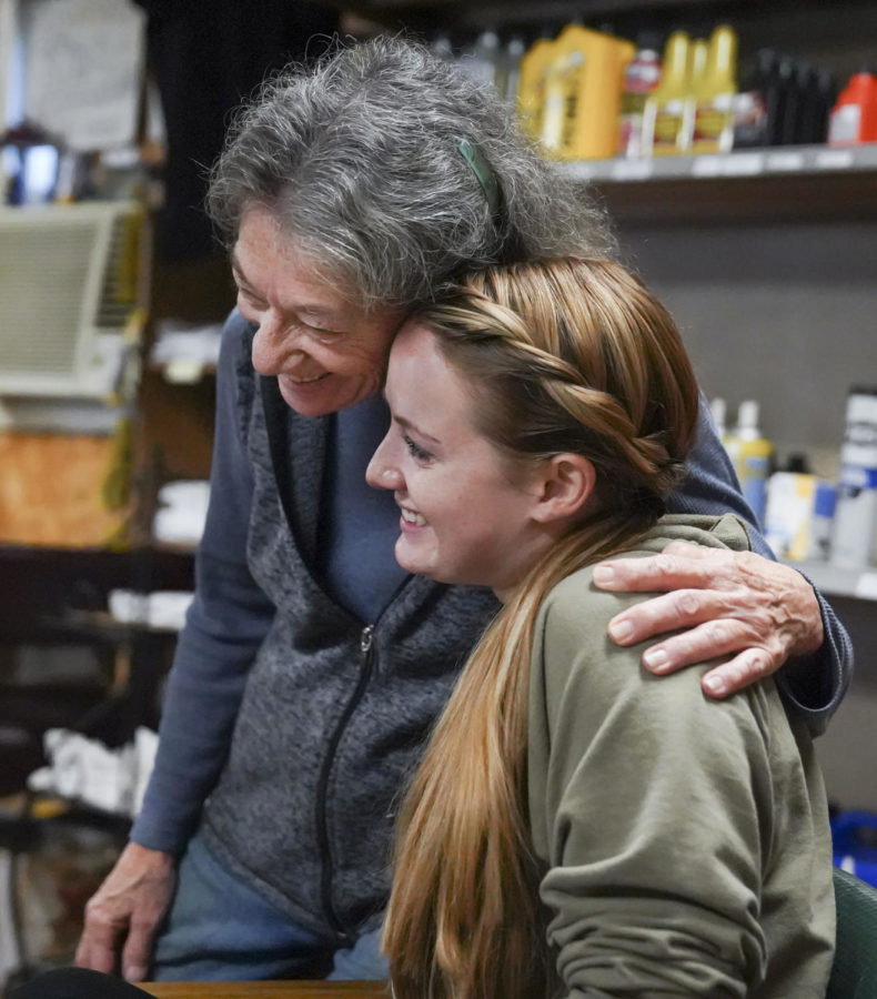 Store owner Katie Clark hugs her daughter Rachel Clark in Frankfort, Kentucky on Wednesday, Oct. 5, 2022. Photo by Bryce Towle.