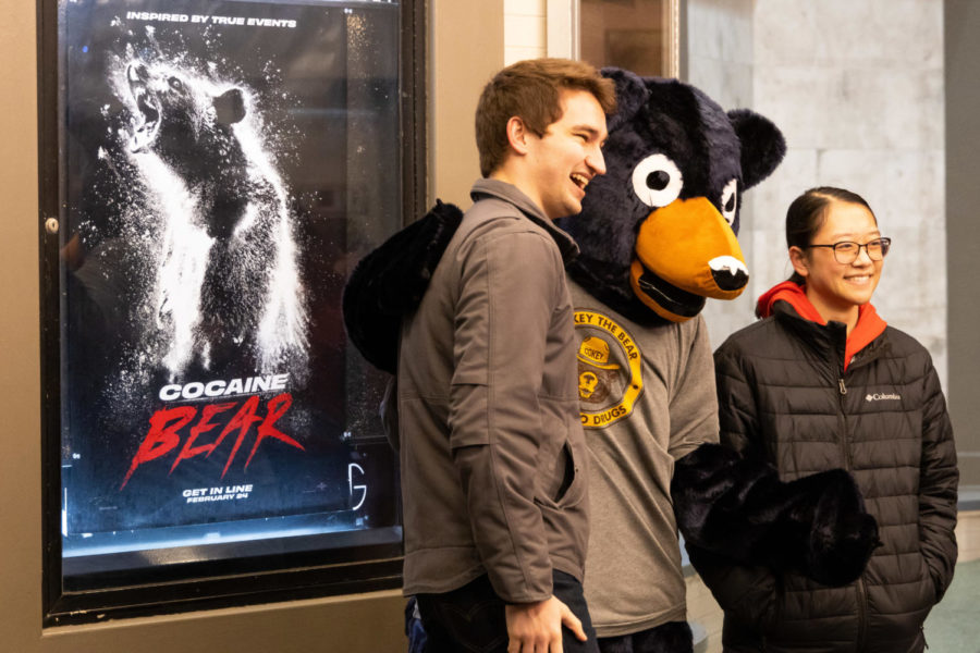 Moviegoers pose for a photo with a Cocaine Bear mascot during the Cocaine Bear premiere on Friday, Feb. 24, 2023, at the Kentucky Theatre in Lexington, Kentucky. Photo by Brady Saylor | Staff