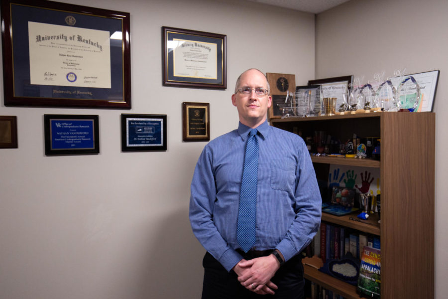 Nathan Vanderford poses for a photo in his office on Thursday, Feb. 16, 2023, at the UK Markey Cancer Center in Lexington, Kentucky. Photo by Samuel Colmar | Staff