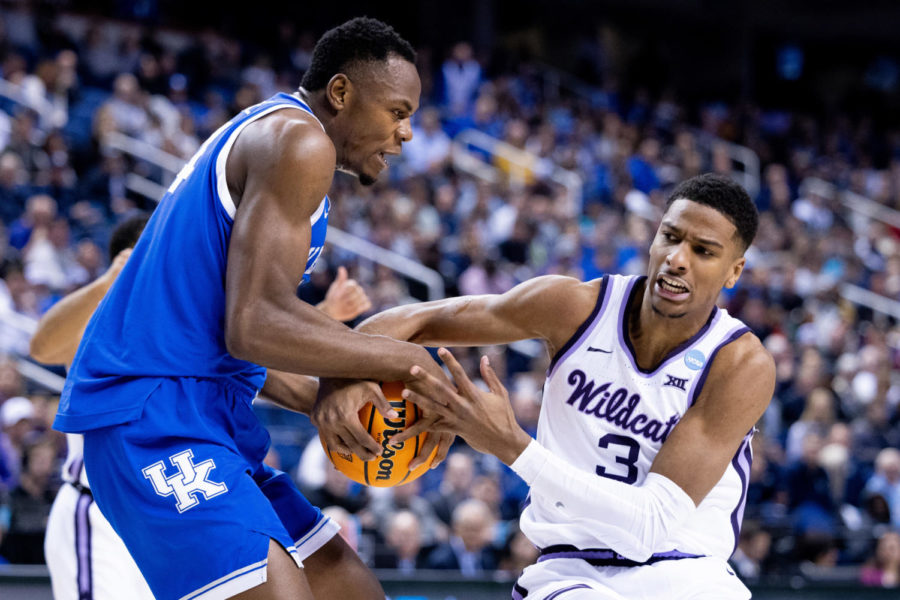 Kentucky Wildcats forward Oscar Tshiebwe (34) and Kansas State Wildcats forward David NGuessan (3) fight for the ball during the No. 6 Kentucky vs. No. 3 Kansas State mens basketball game in the second round of the NCAA Tournament on Sunday, March 19, 2023, at Greensboro Coliseum in Greensboro, North Carolina. Kansas State won 75-69. Photo by Jack Weaver | Staff