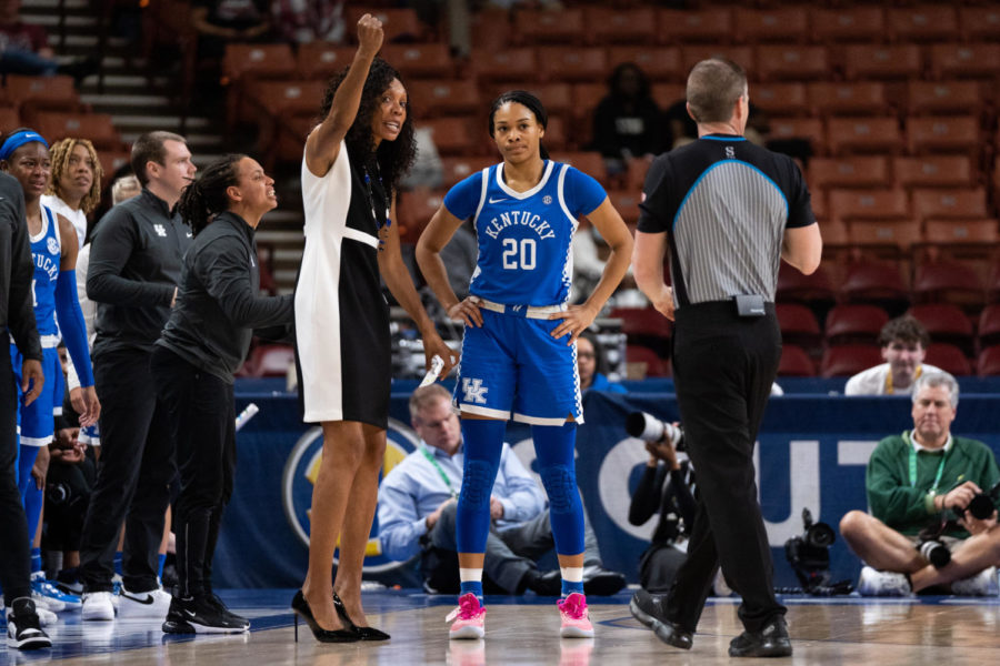 Kentucky Wildcats head coach Kyra Elzy speaks to guard Amiya Jenkins (20) on the sidelines during the No. 14 Kentucky vs. No. 3 Tennessee womens basketball game in the SEC Tournament quarterfinals on Friday, March 3, 2023, at Bon Secours Wellness Arena in Greenville, South Carolina. Tennessee won 80-71. Photo by Carter Skaggs | Staff