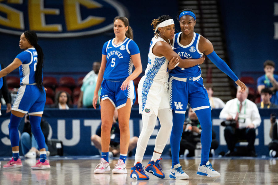 Florida Gators guard Nina Richards (15) holds Kentucky Wildcats guard Robyn Benton (1) during an altercation resulting in seven ejections during the Kentucky vs. Florida womens basketball game in the first round of the SEC Tournament on Wednesday, March 1, 2023, at Bon Secours Wellness Arena in Greenville, South Carolina. Photo by Carter Skaggs | Staff