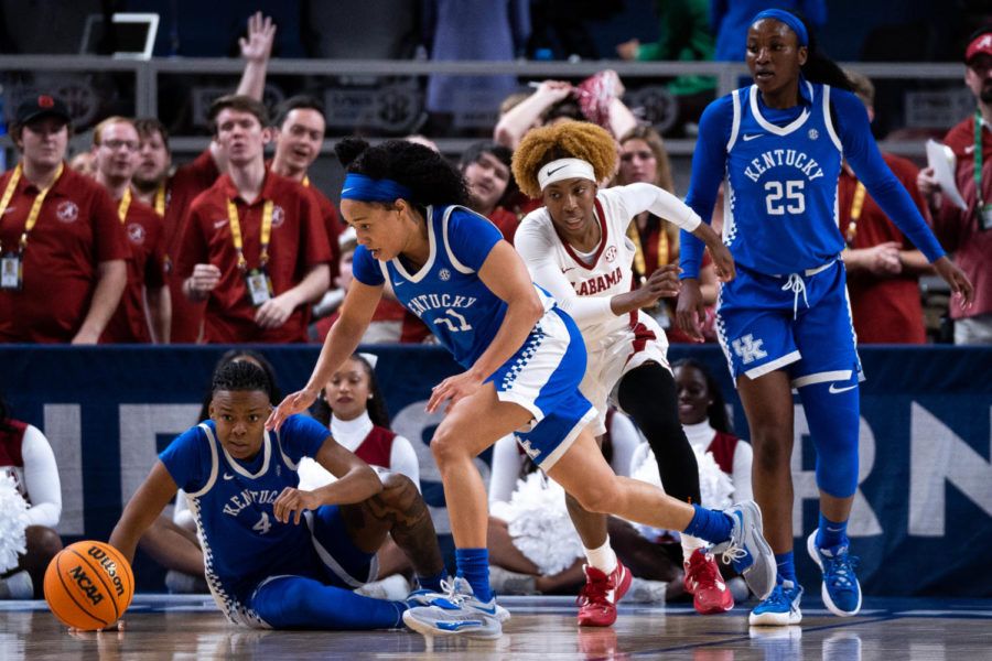 Kentucky Wildcats guards Eniya Russell (4) and Jada Walker (11) scramble for the ball while on defense during the No. 14 Kentucky vs. No. 6 Alabama womens basketball game in the second round of the SEC Tournament on Thursday, March 2, 2023, at Bon Secours Wellness Arena in Greenville, South Carolina. Kentucky won 71-58. Photo by Carter Skaggs | Staff