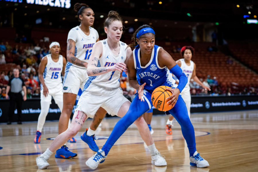 Kentucky Wildcats guard Robyn Benton (1) keeps the ball away from Florida Gators guard Myka Perry (1) during the Kentucky vs. Florida womens basketball game in the first round of the SEC Tournament on Wednesday, March 1, 2023, at Bon Secours Wellness Arena in Greenville, South Carolina. Photo by Carter Skaggs | Staff