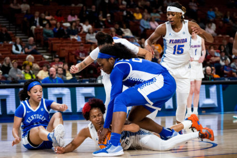 Kentucky Wildcats guard Jada Walker (11) and forward Adebola Adeyeye (25) attempt to gain possession of the ball during the Kentucky vs. Florida womens basketball game in the first round of the SEC Tournament on Wednesday, March 1, 2023, at Bon Secours Wellness Arena in Greenville, South Carolina. Photo by Carter Skaggs | Staff