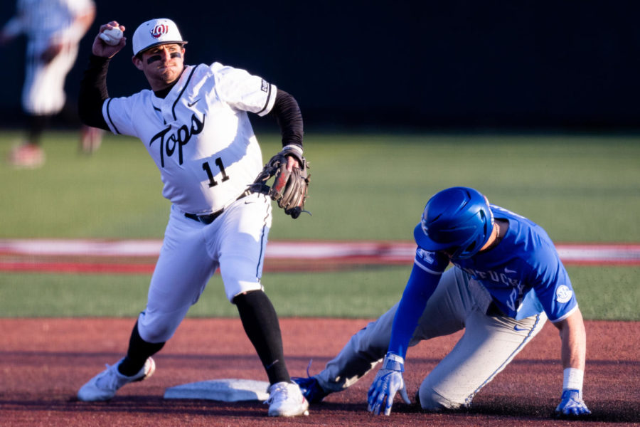 Western Kentucky Hilltoppers infielder Drew Reckart (11) turns a double play as Kentucky Wildcats outfielder Jackson Gray (51) slides into second base during the No. 18 Kentucky vs. Western Kentucky baseball game on Tuesday, March 28, 2023, at Nick Denes Field in Bowling Green, Kentucky. Kentucky won 10-8. Photo by Jack Weaver | Staff