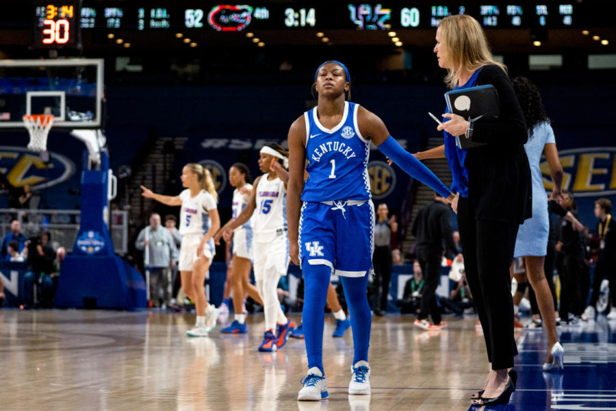 Kentucky Wildcats guard Robyn Benton (1) high fives assistant coach Jen Hoover during the Kentucky vs. Florida womens basketball game in the first round of the SEC Tournament on Wednesday, March 1, 2023, at Bon Secours Wellness Arena in Greenville, South Carolina. Photo by Carter Skaggs | Staff