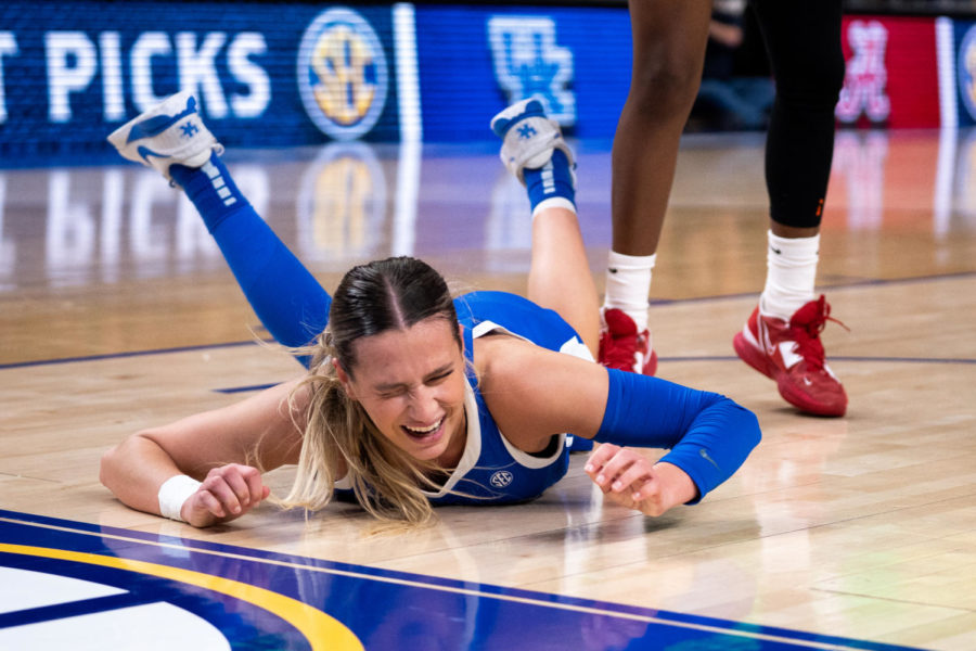 Kentucky Wildcats guard Maddie Scherr (22) falls to the ground as she is fouled during the No. 14 Kentucky vs. No. 6 Alabama womens basketball game in the second round of the SEC Tournament on Thursday, March 2, 2023, at Bon Secours Wellness Arena in Greenville, South Carolina. Kentucky won 71-58. Photo by Carter Skaggs | Staff