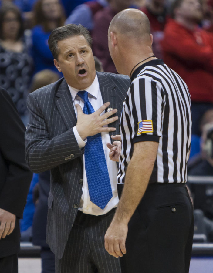 Kentucky Wildcats head coach John Calipari questions an official about a call during the second half of the No. 1 Kentucky vs. No. 8 Cincinnati mens basketball game in the second round of the NCAA Tournament on Saturday, March 21, 2015, at KFC Yum! Center in Louisville, Kentucky. Kentucky won 64-51. Photo by Michael Reaves | Kentucky Kernel