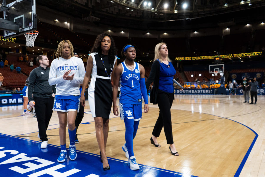 Kentucky Wildcats forward Zennia Thomas (24), head coach Kyra Elzy and guard Robyn Benton (1) walk off the court after the No. 14 Kentucky vs. No. 3 Tennessee womens basketball game in the SEC Tournament quarterfinals on Friday, March 3, 2023, at Bon Secours Wellness Arena in Greenville, South Carolina. Tennessee won 80-71. Photo by Carter Skaggs | Staff
