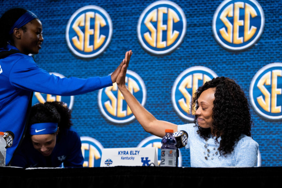 Kentucky Wildcats forward Adebola Adeyeye (25) high fives head coach Kyra Elzy during the post-game press conference after the Kentucky vs. Florida womens basketball game in the first round of the SEC Tournament on Wednesday, March 1, 2023, at Bon Secours Wellness Arena in Greenville, South Carolina. Photo by Carter Skaggs | Staff