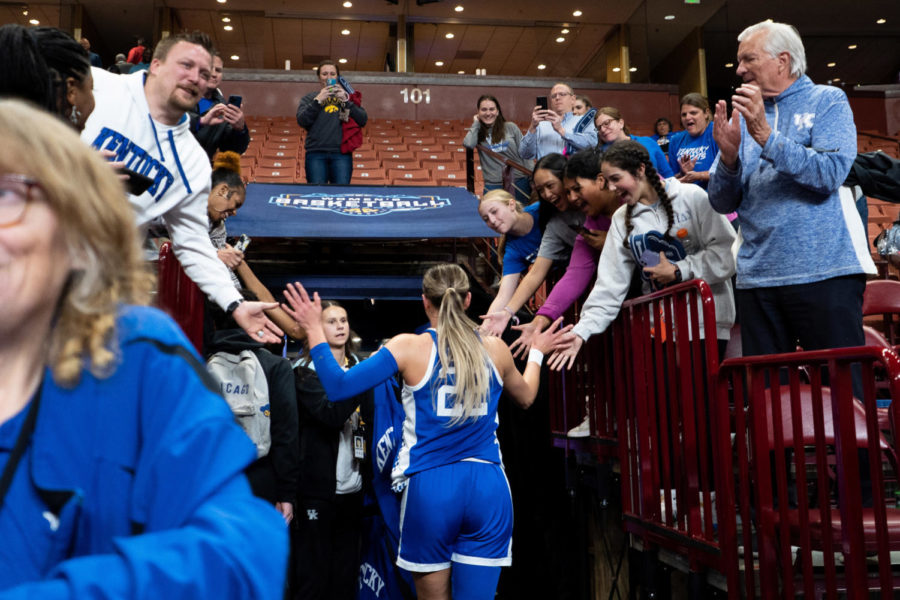 Kentucky Wildcats guard Maddie Scherr (22) high fives fans as she makes her way toward the locker room after the No. 14 Kentucky vs. No. 6 Alabama womens basketball game in the second round of the SEC Tournament on Thursday, March 2, 2023, at Bon Secours Wellness Arena in Greenville, South Carolina. Kentucky won 71-58. Photo by Carter Skaggs | Staff