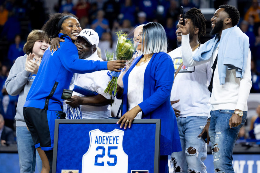 Kentucky Wildcats forward Adebola Adeyeye (25) hugs her family on Senior Day before the Kentucky vs. Tennessee womens basketball game on Sunday, Feb. 26, 2023, at Memorial Coliseum in Lexington, Kentucky. Tennessee won 83-63. Photo by Olivia Hall | Staff