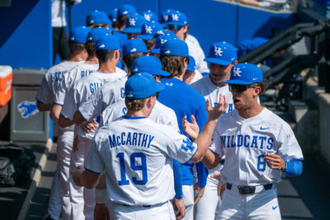 Kentucky players high-five in the dugout before the Kentucky vs. Indiana State baseball game on Sunday, March 5, 2023, at Kentucky Proud Park in Lexington, Kentucky. Kentucky won 7-6. Photo by Travis Fannon | Staff
