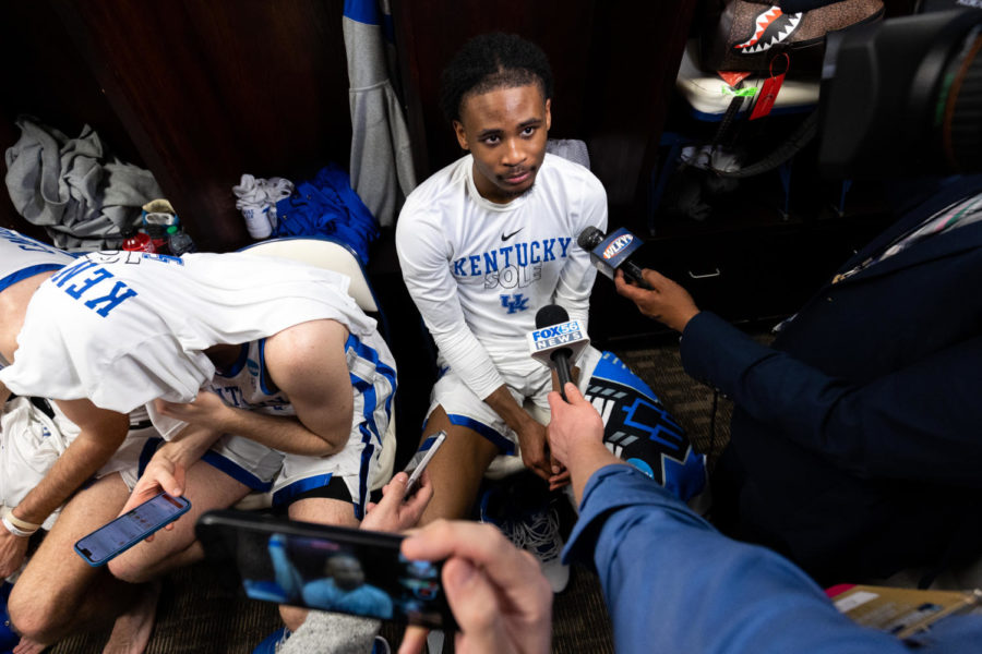 Kentucky Wildcats guard Cason Wallace (22) talks to reporters in the locker room after the No. 6 Kentucky vs. No. 11 Providence mens basketball game in the first round of the NCAA Tournament on Friday, March 17, 2023, at Greensboro Coliseum in Greensboro, North Carolina. Kentucky won 61-53. Photo by Jack Weaver | Staff