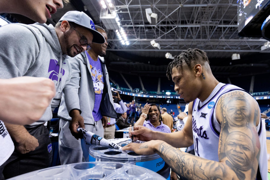 Kansas State Wildcats forward Keyontae Johnson (11) signs a towel after the No. 6 Kentucky vs. No. 3 Kansas State mens basketball game in the second round of the NCAA Tournament on Sunday, March 19, 2023, at Greensboro Coliseum in Greensboro, North Carolina. Kansas State won 75-69. Photo by Jack Weaver | Staff