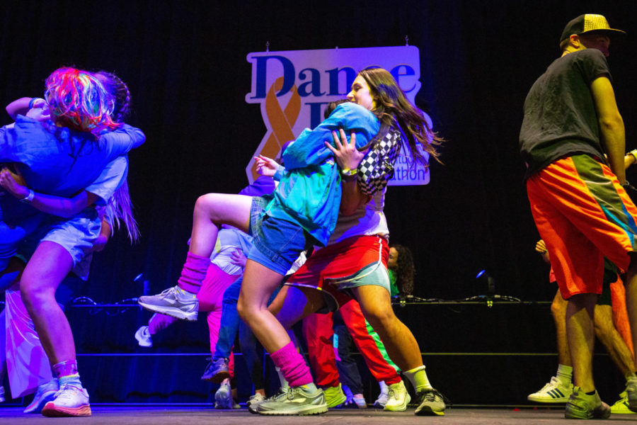 Students dance on stage during the 2023 DanceBlue Marathon on Sunday, March 26, 2023, at Memorial Coliseum in Lexington, Kentucky. Photo by Samuel Colmar | Staff