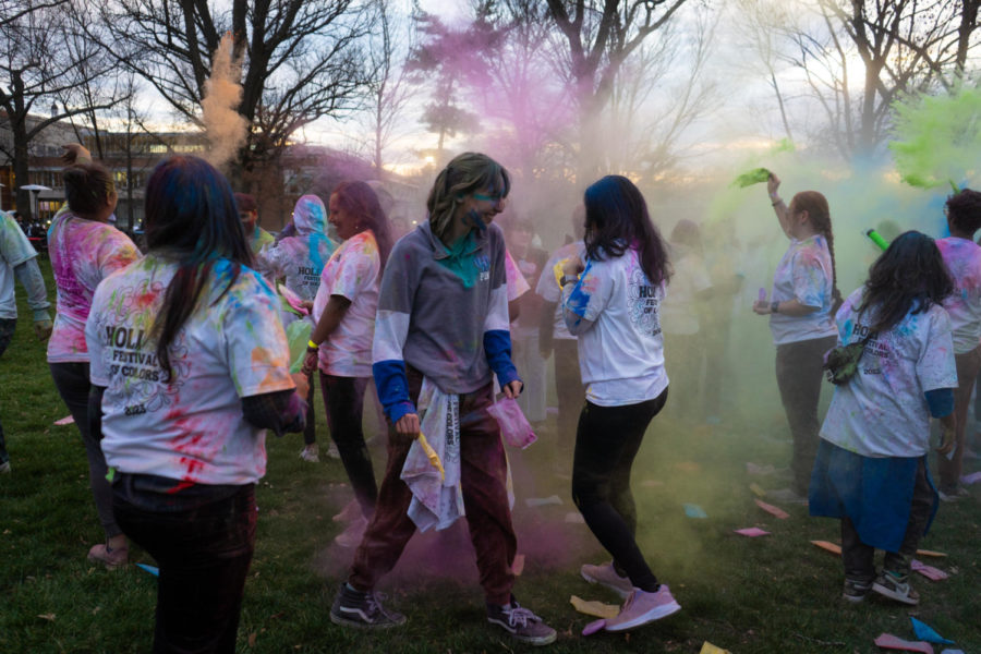 Students participate in color throwing during the Holi celebration put on by the Student Activities Board and Indian Student Association on Wednesday, March 8, 2023, at the Main Lawn in Lexington, Kentucky. Photo by Carter Skaggs | Staff