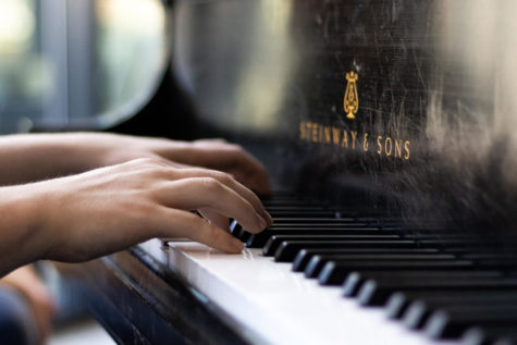 A student plays the piano in the Gatton Student Center on Tuesday, Feb. 28, 2023, in Lexington, Kentucky. Photo by Brady Saylor | Staff