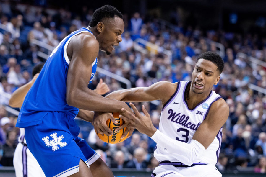 Kentucky Wildcats forward Oscar Tshiebwe (34) and Kansas State Wildcats forward David NGuessan (3) fight for the ball during the No. 6 Kentucky vs. No. 3 Kansas State mens basketball game in the second round of the NCAA Tournament on Sunday, March 19, 2023, at Greensboro Coliseum in Greensboro, North Carolina. Photo by Jack Weaver | Staff
