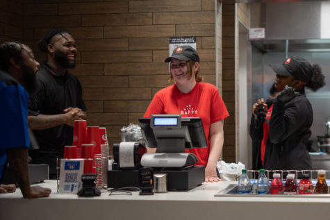 Freshman nursing major Katie Ray shares a laugh with her coworkers while working at Panda Express in the Gatton Student Center on Monday, Feb. 20, 2023, in Lexington, Kentucky. Photo by Carter Skaggs | Staff