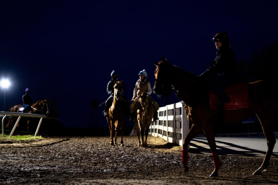 Exercise riders ride horses onto the main track during morning training on the opening day of the Spring Meet on Friday, April 7, 2023, at Keeneland in Lexington, Kentucky. Photo by Carter Skaggs | Staff