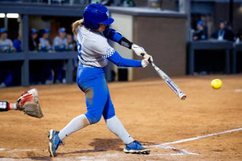 Kentucky Wildcats infielder Erin Coffel (21) hits the ball during the No. 16 Kentucky vs. Louisville softball game on Wednesday, March 29, 2023, at John Cropp Stadium in Lexington, Kentucky. Kentucky won 7-4. Photo by Jack Weaver | Staff