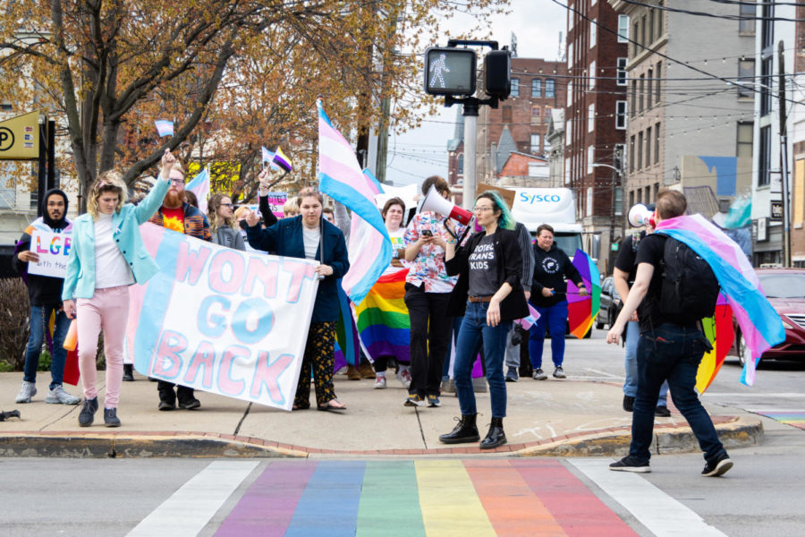 Demonstrators march during the Queer Youth Visibility March on Friday, March 31, 2023, in downtown Lexington in Lexington, Kentucky. Photo by Samuel Colmar | Staff