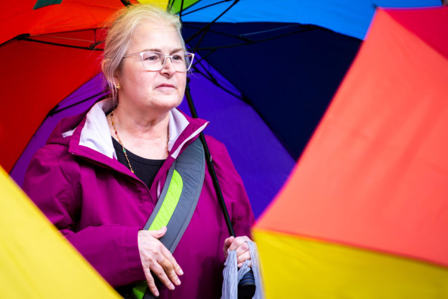 A demonstrator holds an umbrella during the Queer Youth Visibility March on Friday, March 31, 2023, in downtown Lexington in Lexington, Kentucky. Photo by Samuel Colmar | Staff
