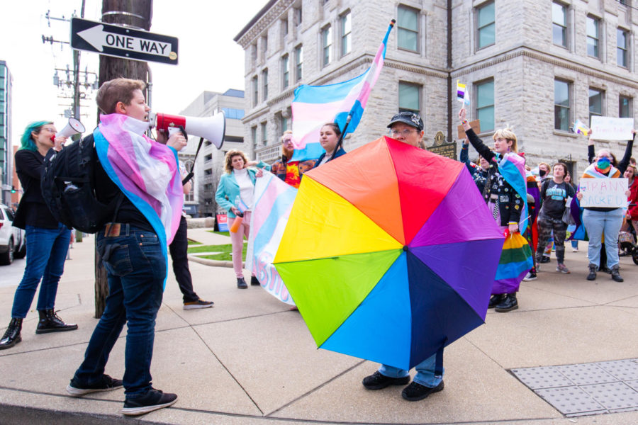 Demonstrators wait to cross the street during the Queer Youth Visibility March on Friday, March 31, 2023, in downtown Lexington in Lexington, Kentucky. Photo by Samuel Colmar | Staff